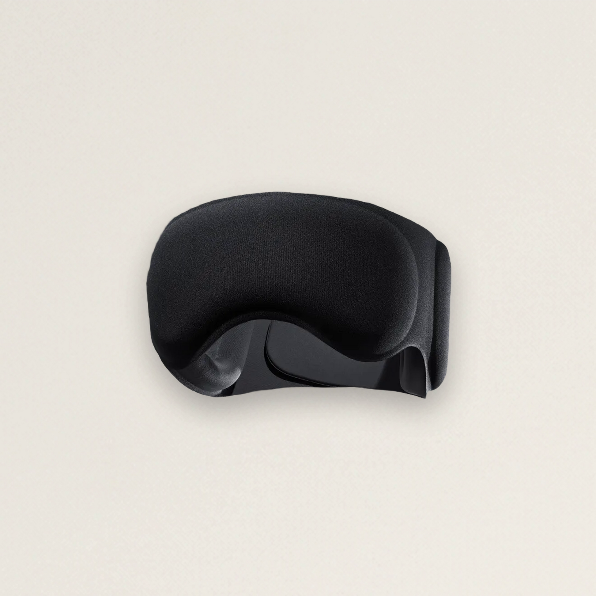 The Blackout weighted recovery sleep mask — matte black sculpted design (product photo)