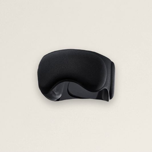 The Blackout weighted recovery sleep mask — matte black sculpted design (product photo)