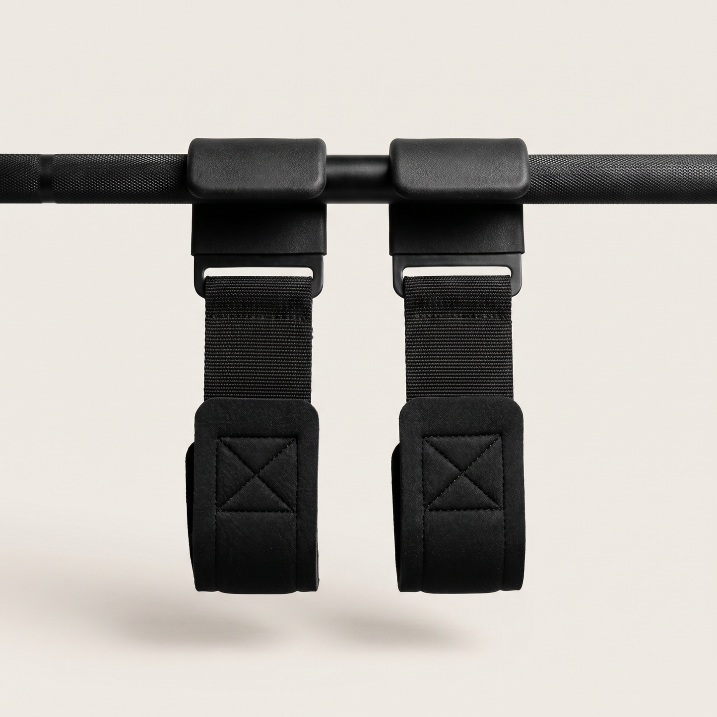 Hook Grips pair hanging on a barbell