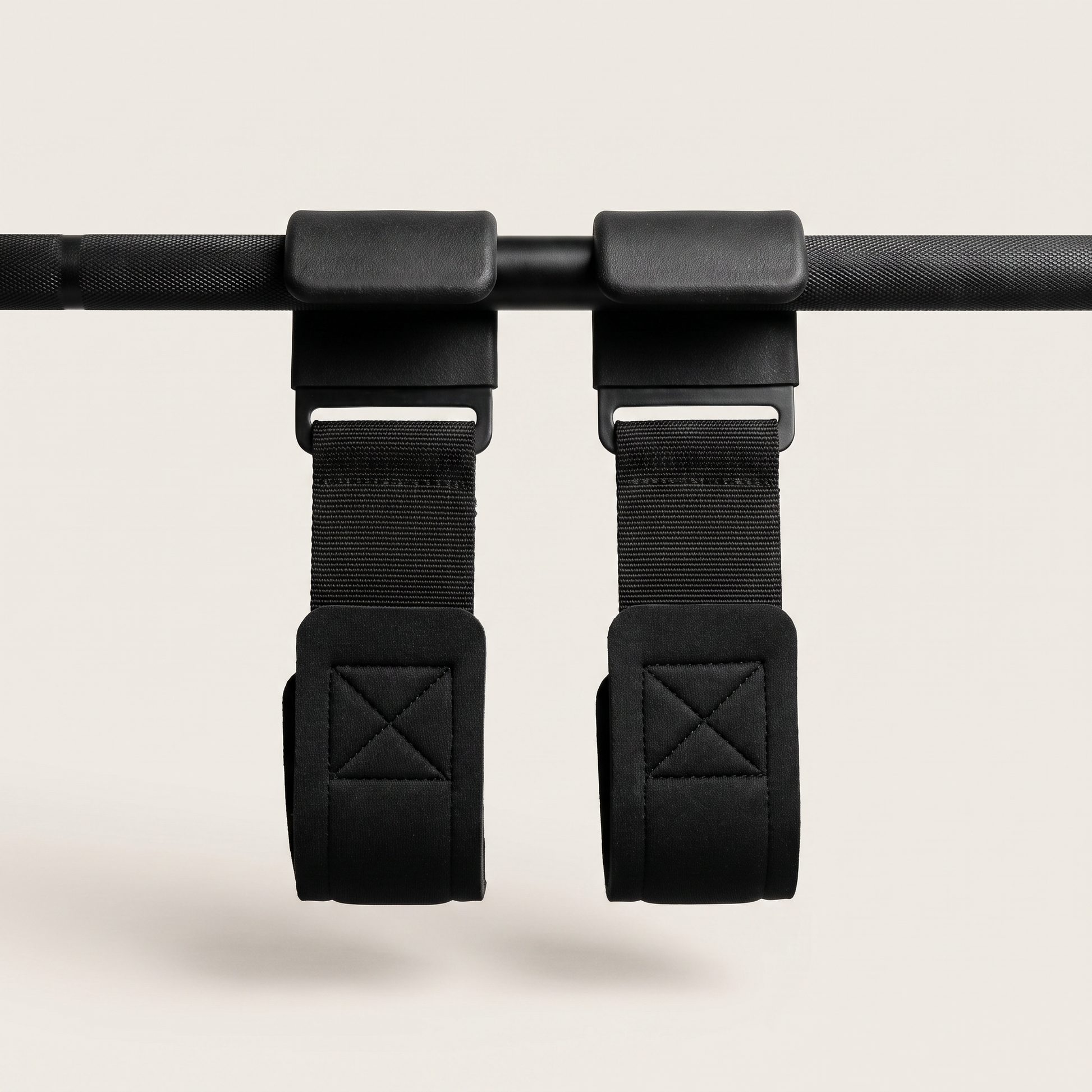 Hook Grips pair hanging on a barbell