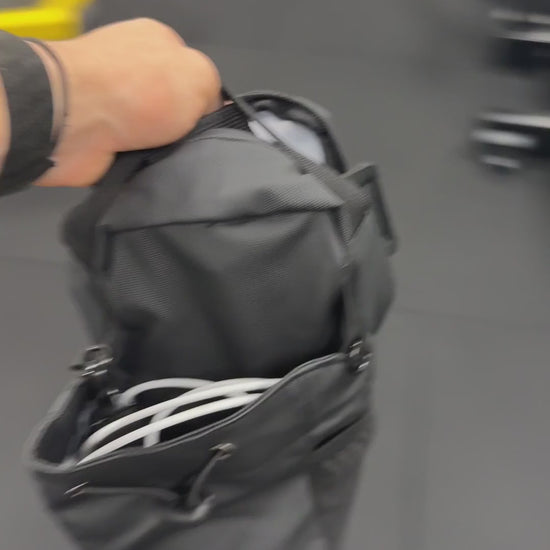 The Stash hung on a machine with gear inside, staying put hands-free